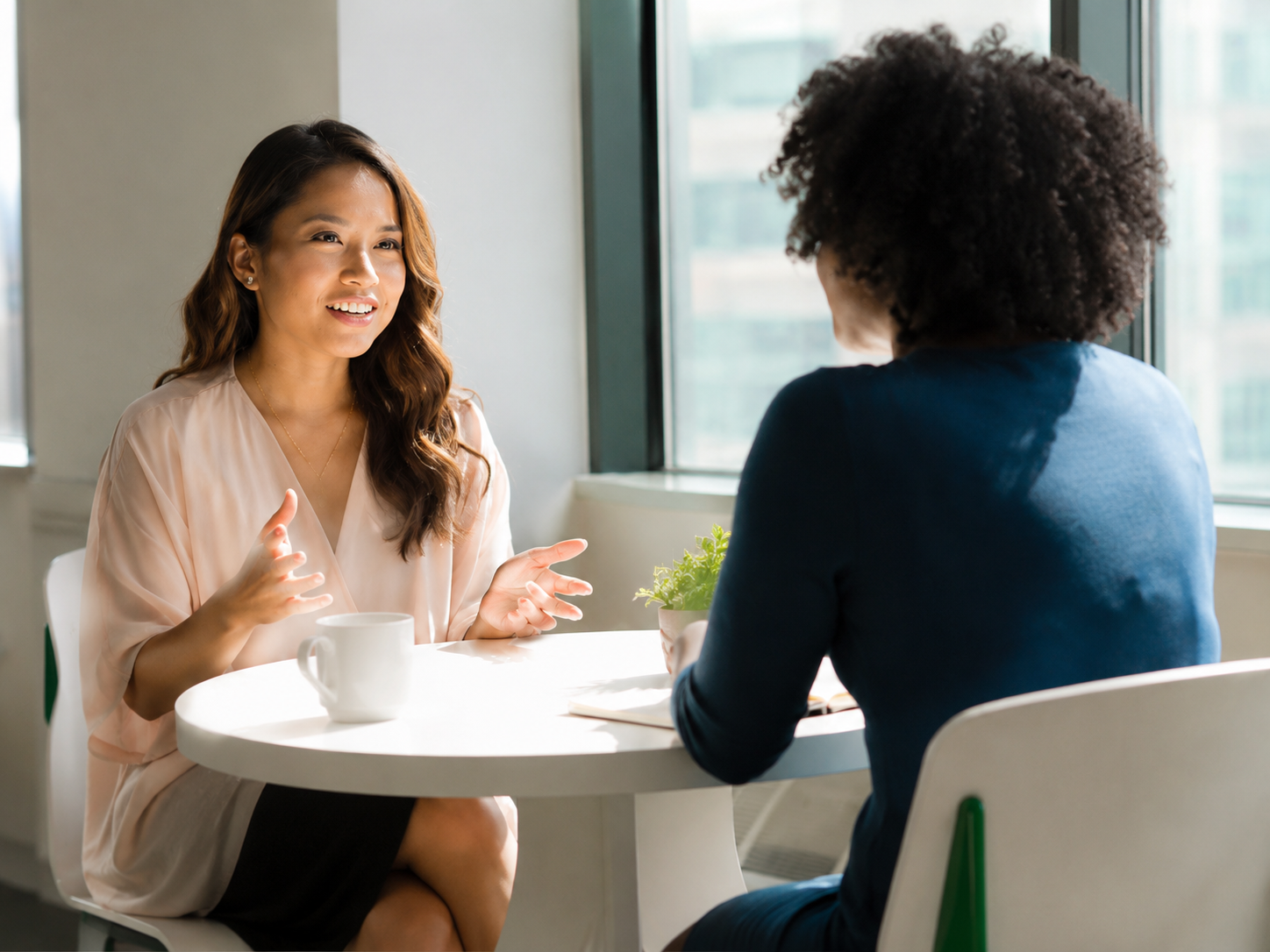 Client reviewing loan options with a specialist in a relaxed meeting